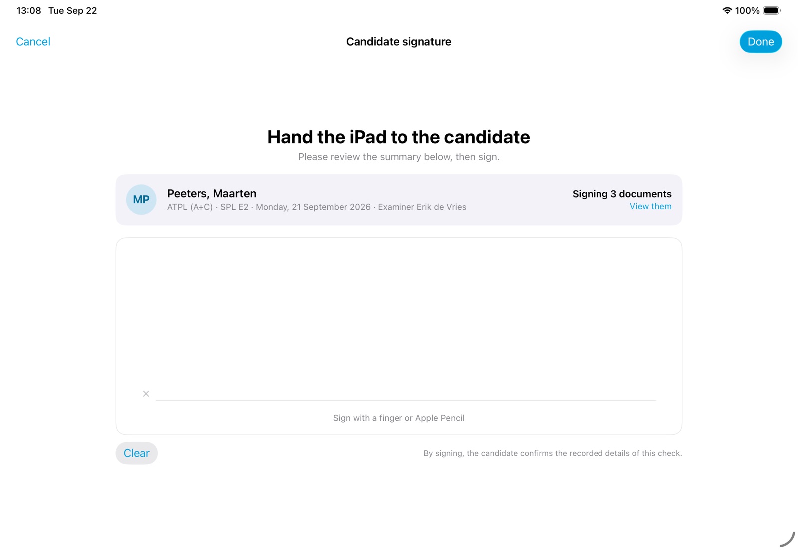 The signing screen: hand the iPad to the candidate, a summary of the check and a space to sign
